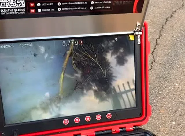 CCTV stormwater camera monitor showing the inside of a drain pipe on a job