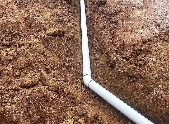 Channel drain installed along a driveway